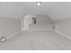 Bright and spacious attic featuring neutral colored walls and carpeting at 381 Heart Pine Dr, Wendell, NC 27591