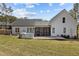 Large backyard with a wooden deck and covered porch, perfect for outdoor entertaining at 381 Heart Pine Dr, Wendell, NC 27591