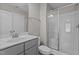 Bathroom featuring a glass-enclosed shower, neutral walls, and a framed vanity mirror at 381 Heart Pine Dr, Wendell, NC 27591
