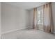 Bedroom with plush carpet, natural light, and large windows with curtains at 381 Heart Pine Dr, Wendell, NC 27591
