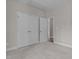 Bright bedroom featuring plush carpeting and closet doors with modern hardware at 381 Heart Pine Dr, Wendell, NC 27591