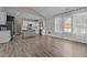 Bright kitchen features white cabinets, stainless steel appliances, and a large island for cooking at 381 Heart Pine Dr, Wendell, NC 27591