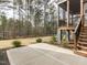 Backyard of home with screened in porch, patio, and view of surrounding woods at 3908 Sage Ct, Wake Forest, NC 27587