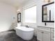 Luxurious bathroom boasts a freestanding tub, double vanities, and stylish fixtures at 3908 Sage Ct, Wake Forest, NC 27587