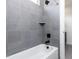 Bathroom features a tiled shower and tub with chrome fixtures at 3908 Sage Ct, Wake Forest, NC 27587