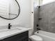 Stylish bathroom features a modern vanity, tub-shower combo, and sleek fixtures at 3908 Sage Ct, Wake Forest, NC 27587