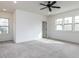 Bright bedroom with ceiling fan and carpeted floors, and large windows at 3908 Sage Ct, Wake Forest, NC 27587