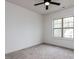 Bedroom features neutral carpeting, a ceiling fan, and a window at 3908 Sage Ct, Wake Forest, NC 27587