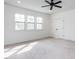Bright bedroom with ceiling fan and carpeted floors, and large windows at 3908 Sage Ct, Wake Forest, NC 27587