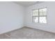 Neutral bedroom with carpet, natural light, and a scenic outdoor view at 3908 Sage Ct, Wake Forest, NC 27587