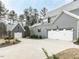 A gorgeous two-story home with a two-car garage and a detached garage with a concrete driveway at 3908 Sage Ct, Wake Forest, NC 27587