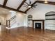Cozy living room featuring a fireplace, built-in shelving, and a staircase to the upper level at 3908 Sage Ct, Wake Forest, NC 27587