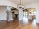 Open-concept living space with hardwood floors, fireplace, and staircase at 3908 Sage Ct, Wake Forest, NC 27587