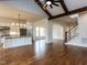 Open-concept living space with hardwood floors, staircase, and kitchen island at 3908 Sage Ct, Wake Forest, NC 27587