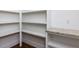 Bright pantry featuring white shelving and a countertop, perfect for organized storage and convenience at 3908 Sage Ct, Wake Forest, NC 27587