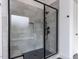 Modern walk-in shower showcases sleek tile work, glass enclosure, and built-in bench at 3908 Sage Ct, Wake Forest, NC 27587