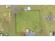 Aerial view of a large, fenced backyard with a well-maintained lawn and storage shed at 40 Hill Rd, Franklinton, NC 27525