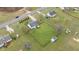 Aerial view of home and backyard with large, fenced yard, complemented by a deck and outbuildings at 40 Hill Rd, Franklinton, NC 27525