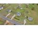 Expansive aerial view of a home with a large, fenced yard, surrounded by mature trees and neighborhood homes at 40 Hill Rd, Franklinton, NC 27525