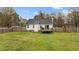 Lovely backyard with a large lawn and a wooden deck for outdoor gatherings at 40 Hill Rd, Franklinton, NC 27525