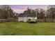A spacious backyard with a wooden deck, perfect for outdoor entertaining and relaxation at 40 Hill Rd, Franklinton, NC 27525