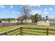 Large, fenced backyard with a storage shed, offering plenty of room for outdoor entertaining and gardening at 40 Hill Rd, Franklinton, NC 27525