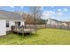 Backyard with a wooden deck and fenced yard, perfect for grilling and enjoying outdoor living at 40 Hill Rd, Franklinton, NC 27525