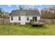 Expansive backyard features a wooden deck and a lush green lawn, ideal for relaxation at 40 Hill Rd, Franklinton, NC 27525