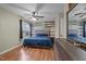 This inviting bedroom includes a wooden floor and a unique wooden plank accent wall at 40 Hill Rd, Franklinton, NC 27525