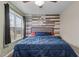 This cozy bedroom features a decorative wood plank wall and a large window for natural light at 40 Hill Rd, Franklinton, NC 27525