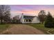 Charming single-story home featuring a welcoming front porch, lush green lawn, and long driveway at 40 Hill Rd, Franklinton, NC 27525