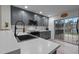 Updated kitchen featuring gray cabinets, stainless steel appliances, and a sliding door for outdoor access at 40 Hill Rd, Franklinton, NC 27525