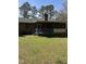 View of screened-in back porch with wooden railings and lattice detail at 4001 W Antioch Dr, Oxford, NC 27565