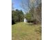 View of the backyard featuring a small shed and ample space, perfect for outdoor activities at 4001 W Antioch Dr, Oxford, NC 27565