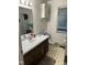 Functional bathroom featuring a vanity with sink, toilet, and cabinet storage at 4001 W Antioch Dr, Oxford, NC 27565