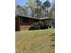 Charming one-story brick home with well-maintained lawn and attached garage at 4001 W Antioch Dr, Oxford, NC 27565