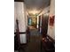 Hallway with vintage wallpaper and carpet leading to another room at 4001 W Antioch Dr, Oxford, NC 27565