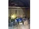 An interior view of a wooden shed with storage and various tools and equipment at 4001 W Antioch Dr, Oxford, NC 27565