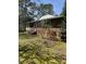 Brick home featuring side entrance with wooden steps and yard at 4001 W Antioch Dr, Oxford, NC 27565