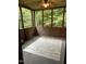 Cozy sunroom with paneled walls, a ceiling fan, and access to the outdoors at 4001 W Antioch Dr, Oxford, NC 27565