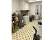 Well-lit utility area featuring a washing machine, water heater, and ample storage space at 4001 W Antioch Dr, Oxford, NC 27565