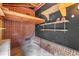 Unfinished basement with brick walls and ceiling beams at 407 W Cornwall Rd, Cary, NC 27511