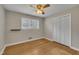 Bright bedroom with wood floors, a ceiling fan, natural light and a closet at 407 W Cornwall Rd, Cary, NC 27511