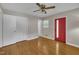 Bright bedroom with hardwood floors, ceiling fan and closet space at 407 W Cornwall Rd, Cary, NC 27511