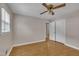 This bedroom features a ceiling fan, hardwood floors and a closet at 407 W Cornwall Rd, Cary, NC 27511