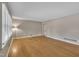 Expansive living area featuring sleek hardwood floors, neutral walls, and lots of natural light at 407 W Cornwall Rd, Cary, NC 27511