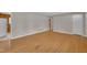 Spacious room featuring hardwood floors, neutral walls, and an open floor plan at 407 W Cornwall Rd, Cary, NC 27511