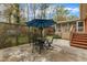 Back patio with table, chairs, and blue umbrella at 407 W Cornwall Rd, Cary, NC 27511