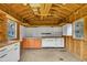 This shed boasts an open rafter ceiling, pegboard wall, built-in work bench and great natural light from the windows at 407 W Cornwall Rd, Cary, NC 27511