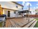Spacious wooden back deck with a gazebo and grill, ideal for outdoor entertaining and relaxation at 409 Machost Dr, Garner, NC 27529
